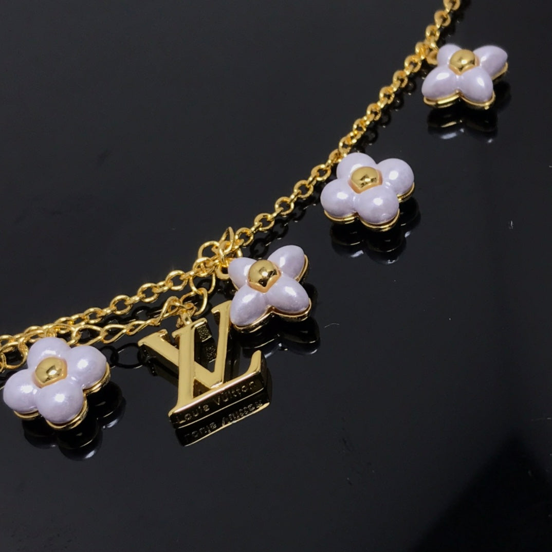 Dream LOGO 6 MOTIF STAR AND SUN GOLD BRACELET