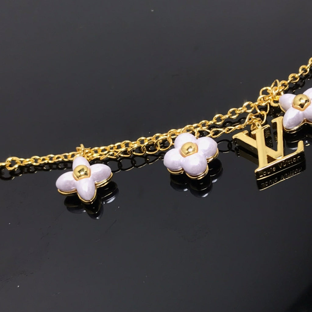Dream LOGO 6 MOTIF STAR AND SUN GOLD BRACELET