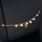 Dream LOGO 6 MOTIF STAR AND SUN GOLD BRACELET